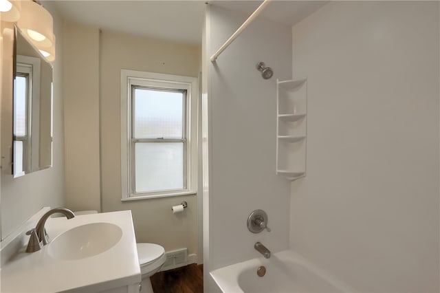 full bathroom featuring vanity, bathing tub / shower combination, toilet, and hardwood / wood-style flooring