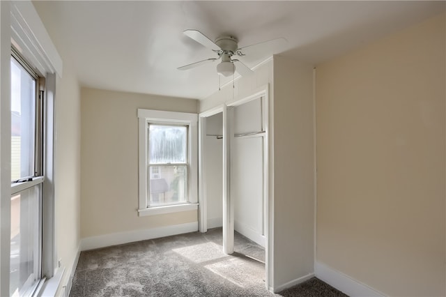 unfurnished bedroom featuring a closet, carpet, and ceiling fan