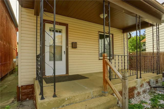 doorway to property featuring covered porch