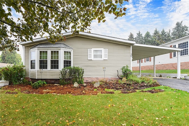 view of side of home featuring a yard