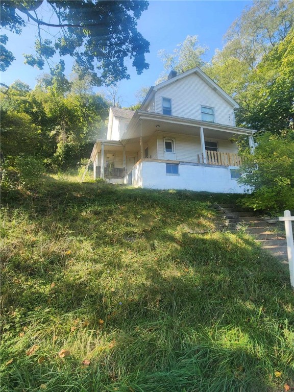 view of front of home featuring covered porch