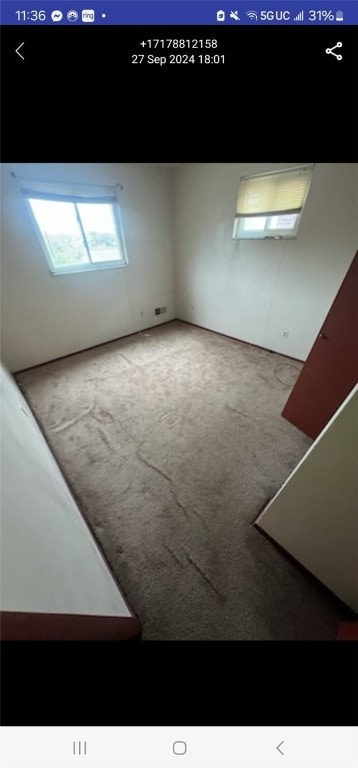 view of carpeted spare room