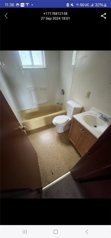 full bathroom featuring vanity, toilet, and  shower combination