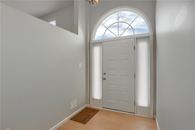 foyer entrance with light hardwood / wood-style floors