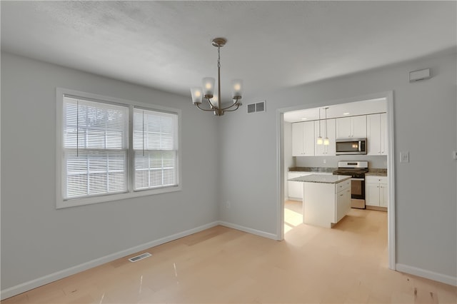 interior space with a notable chandelier