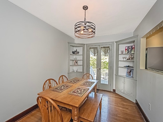 dining area with french doors and hardwood / wood-style flooring