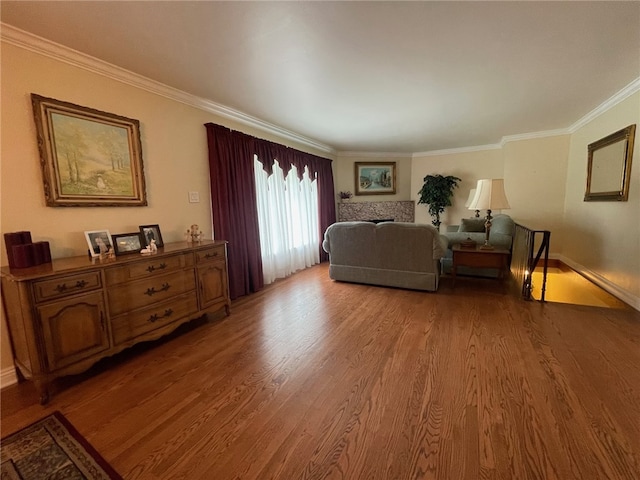 living room with crown molding and hardwood / wood-style floors