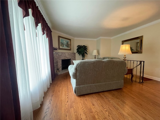 living room with light hardwood / wood-style flooring and crown molding