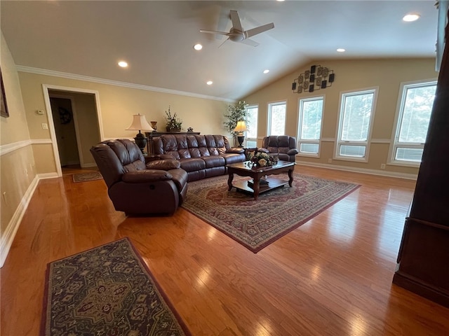 living room featuring ceiling fan, vaulted ceiling, light hardwood / wood-style flooring, and ornamental molding