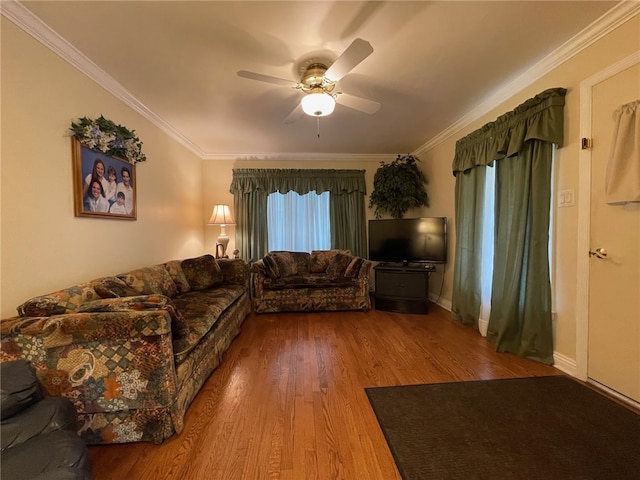 living room with ceiling fan, hardwood / wood-style flooring, and ornamental molding