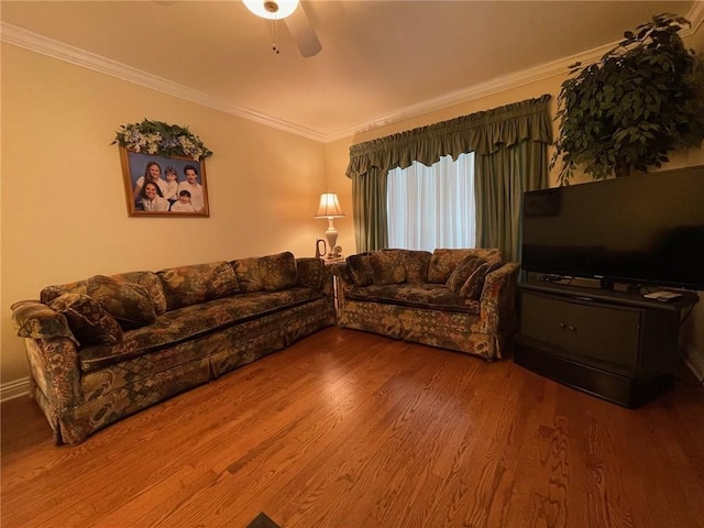 living room with ceiling fan, wood finished floors, and ornamental molding