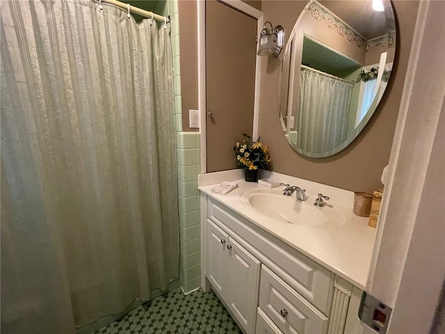 bathroom featuring vanity, a shower with curtain, and tile patterned floors