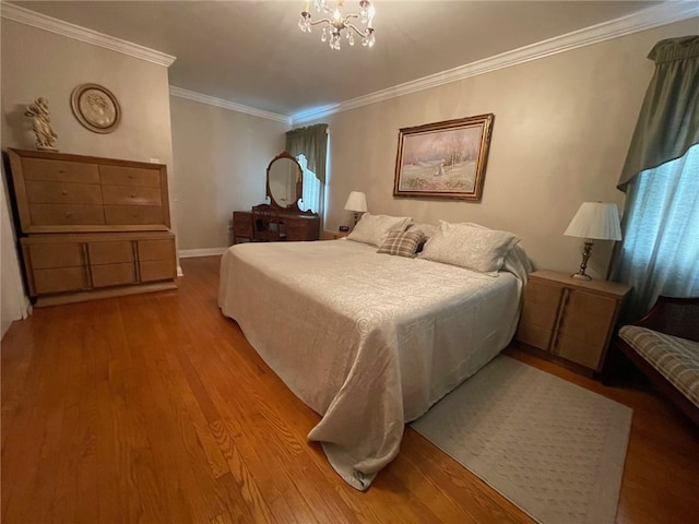 bedroom with wood-type flooring, a notable chandelier, and crown molding