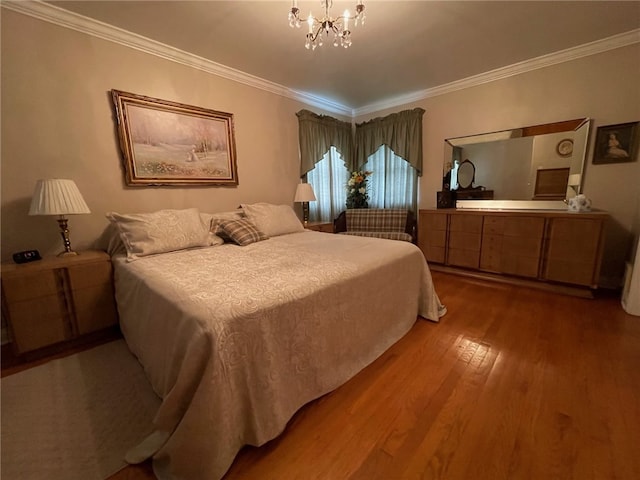 bedroom with ornamental molding, wood-type flooring, and a chandelier