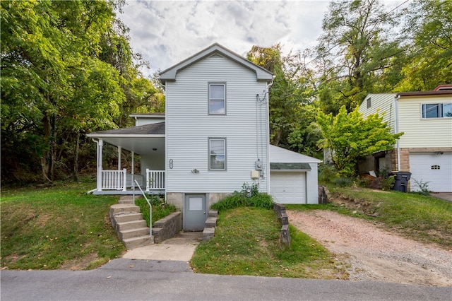 view of front of property with covered porch and a garage