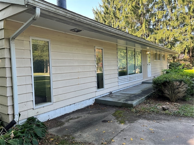 view of property exterior featuring a patio area