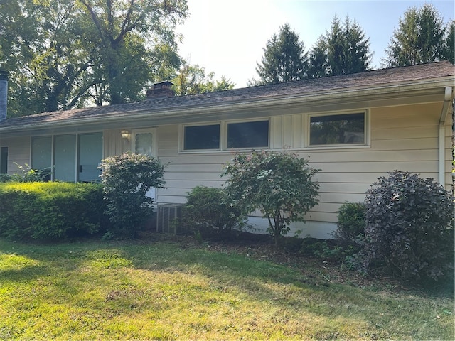 view of property exterior with a yard