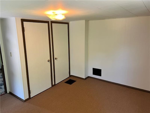 unfurnished bedroom with light carpet