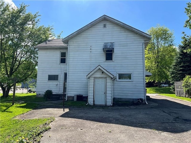 back of house with a yard