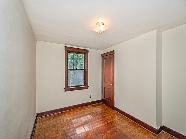 empty room with light hardwood / wood-style flooring