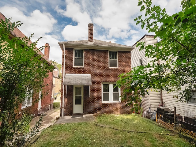 back of house with a yard