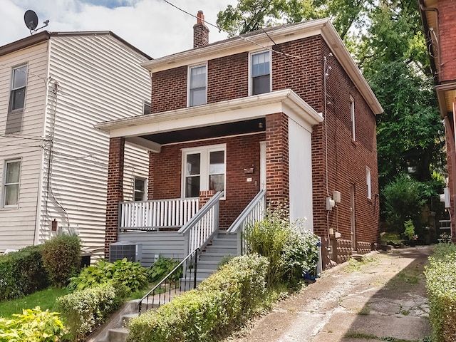 view of front facade featuring cooling unit and covered porch