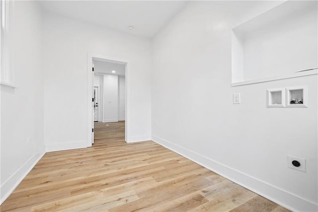 clothes washing area with washer hookup, light hardwood / wood-style flooring, and hookup for an electric dryer