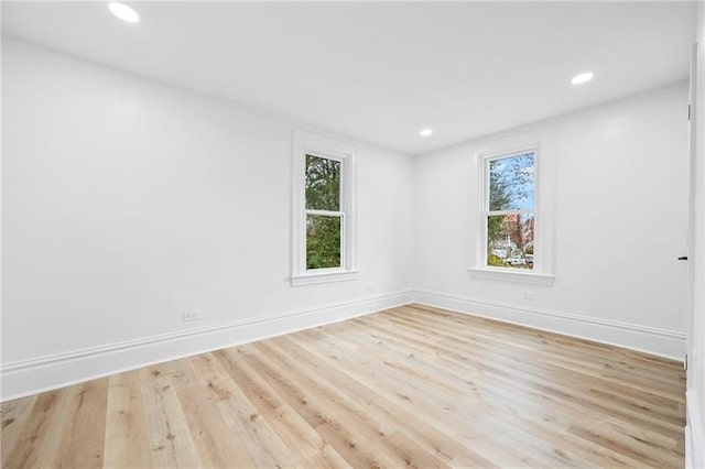 spare room featuring light wood-type flooring