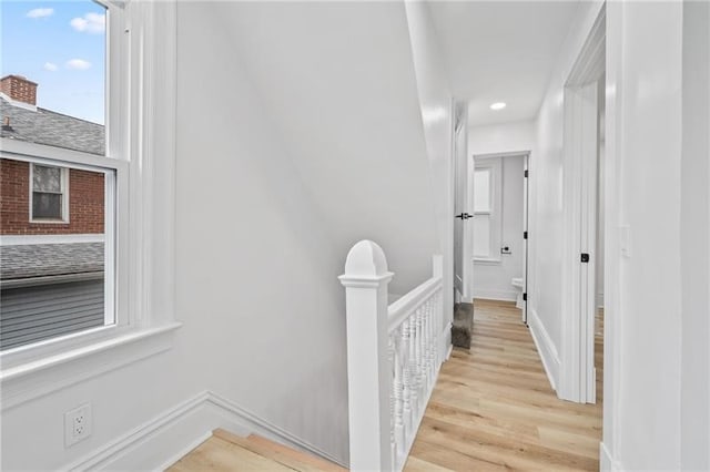 corridor featuring light hardwood / wood-style floors