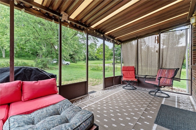 sunroom featuring wood ceiling