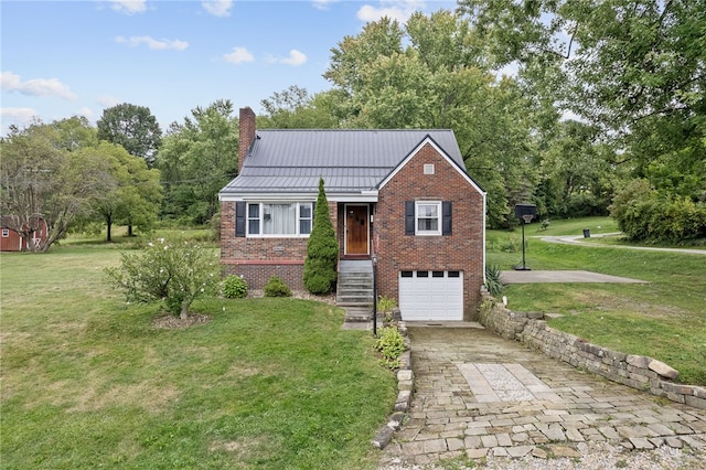 view of front of property with a garage and a front lawn