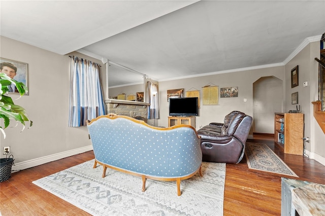 living room with ornamental molding and hardwood / wood-style floors