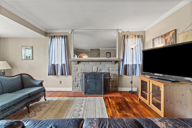 living room with crown molding, a fireplace, and dark hardwood / wood-style flooring