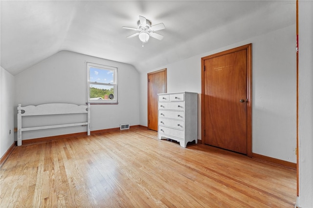 additional living space featuring light wood-type flooring, vaulted ceiling, and ceiling fan