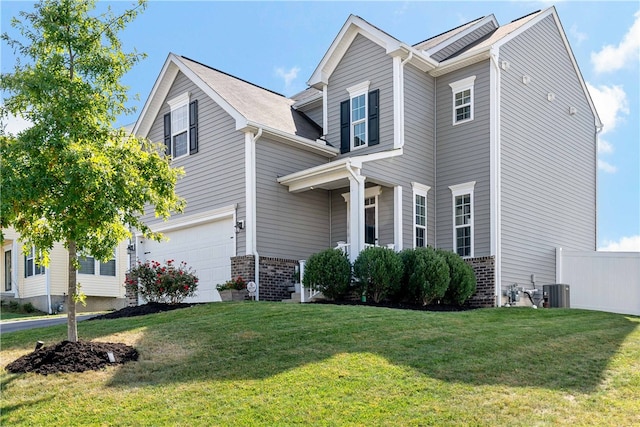 view of front of property with a garage and a front lawn