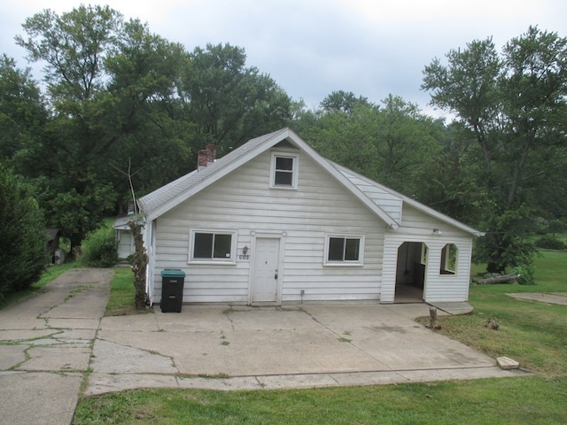 exterior space with a patio and a front yard