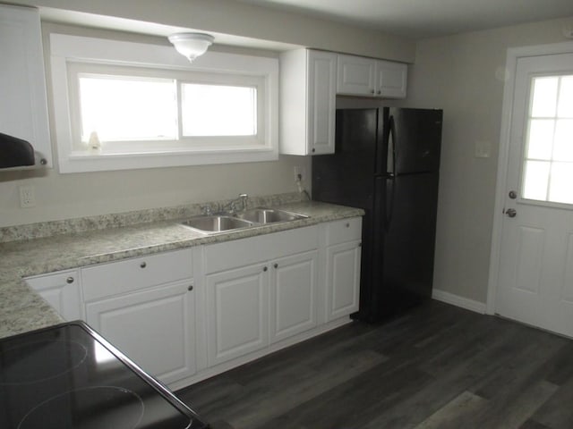 kitchen with white cabinets, plenty of natural light, dark wood-type flooring, and sink