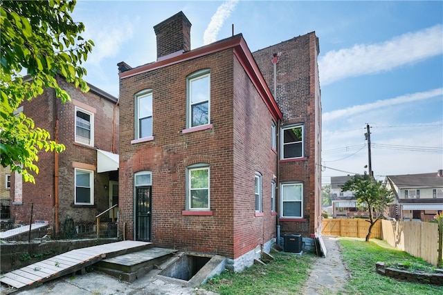 view of front of home featuring central air condition unit