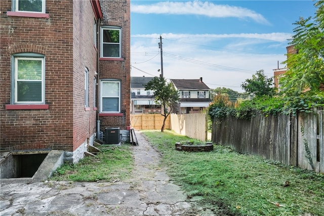 view of yard with central AC unit