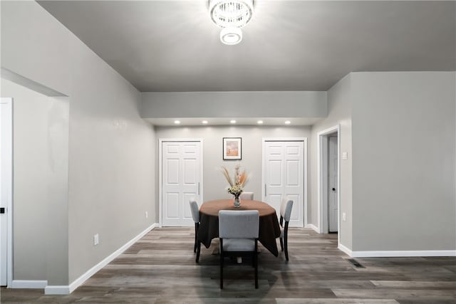 dining area with dark hardwood / wood-style floors