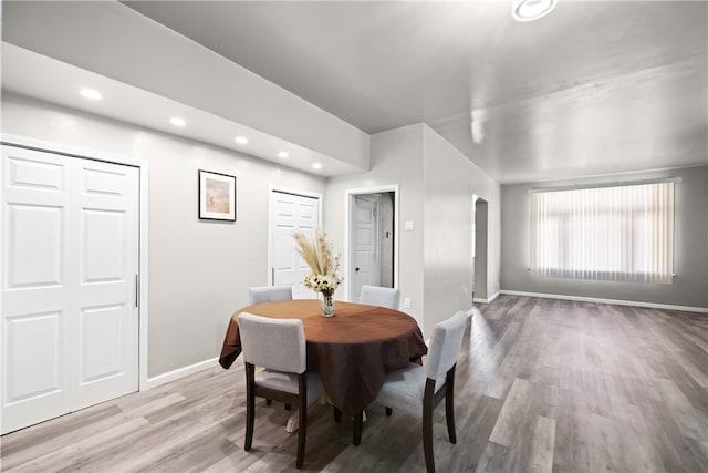 dining space featuring light wood-type flooring