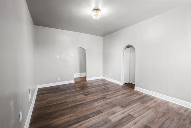 empty room featuring dark hardwood / wood-style flooring