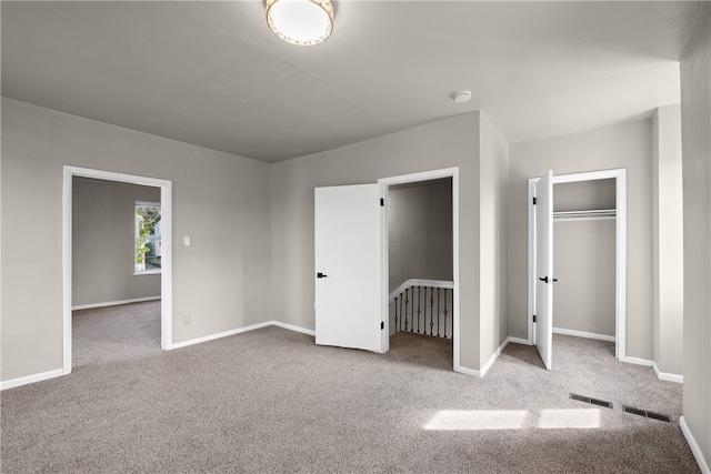 unfurnished bedroom with light carpet