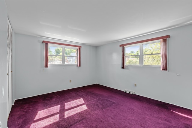 empty room featuring carpet flooring