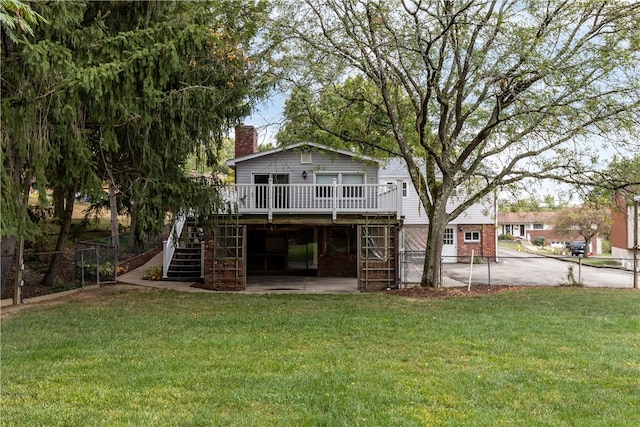 exterior space featuring a yard and a wooden deck