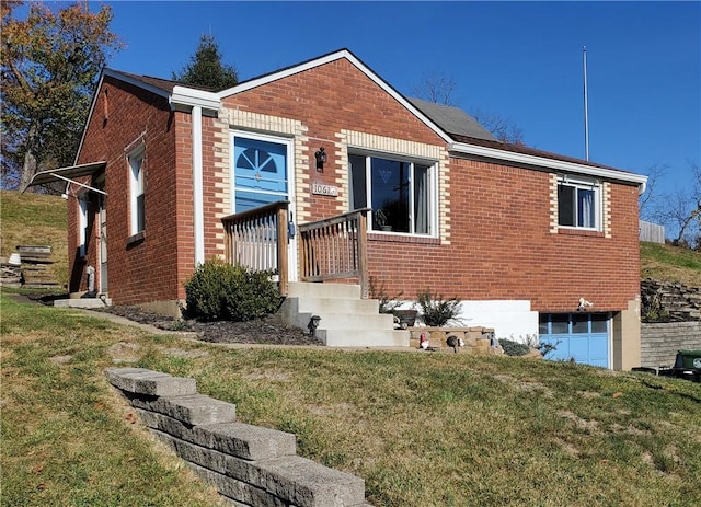 view of front of property with a garage and a front lawn