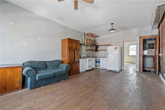 living room with ceiling fan and light hardwood / wood-style flooring