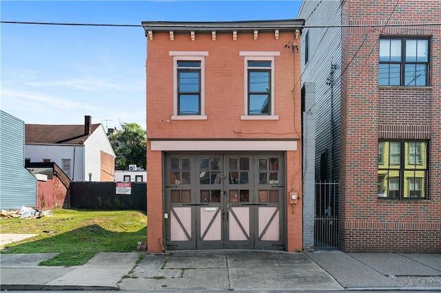 622 Emlin St, East Allegheny, PA 15212 - view of front of house with a garage, brick siding, and driveway