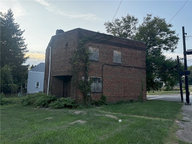 view of home's exterior featuring a yard