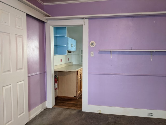 interior space with crown molding